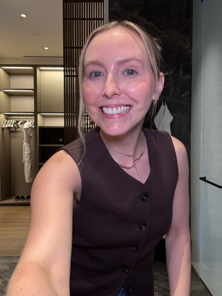 photo of woman smiling in selfie after brushing her teeth with dyson's camerajet toothbrush